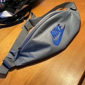 Nike waist pouch. Like new.  Gray with blue Nike logo.